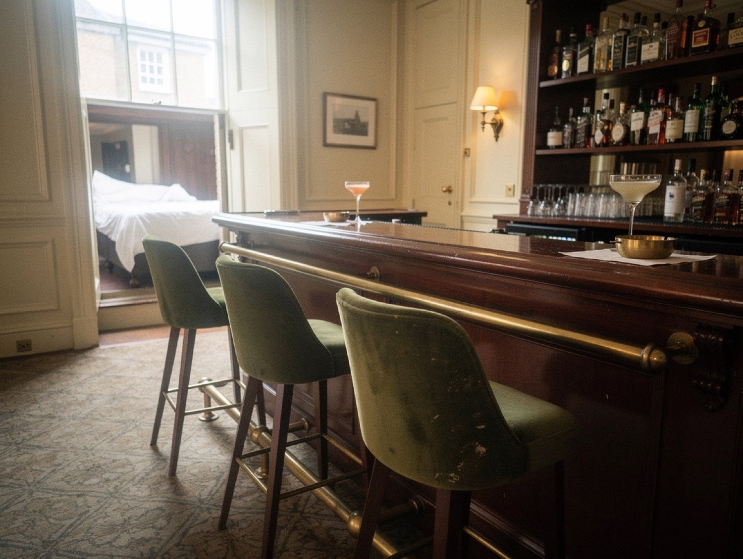 The Library Bar — mahogany bar and a half-finished cocktail